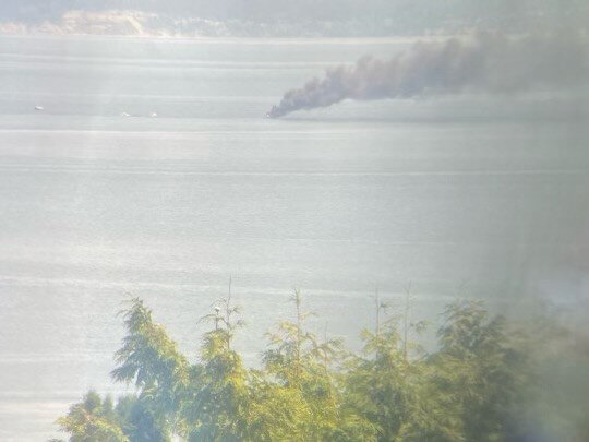 Smoke from a burning boat in Hood Canal can be seen from Jefferson County on Friday.